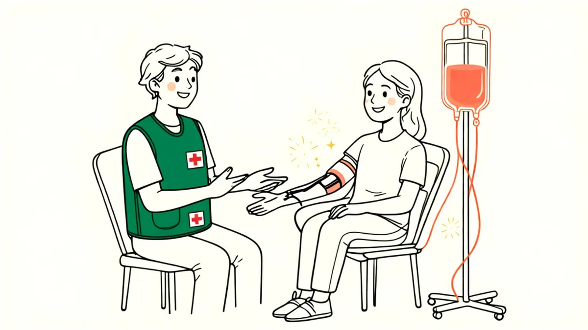 A Red Cross volunteer in a green vest checks in a smiling blood donor seated beside a blood collection bag.