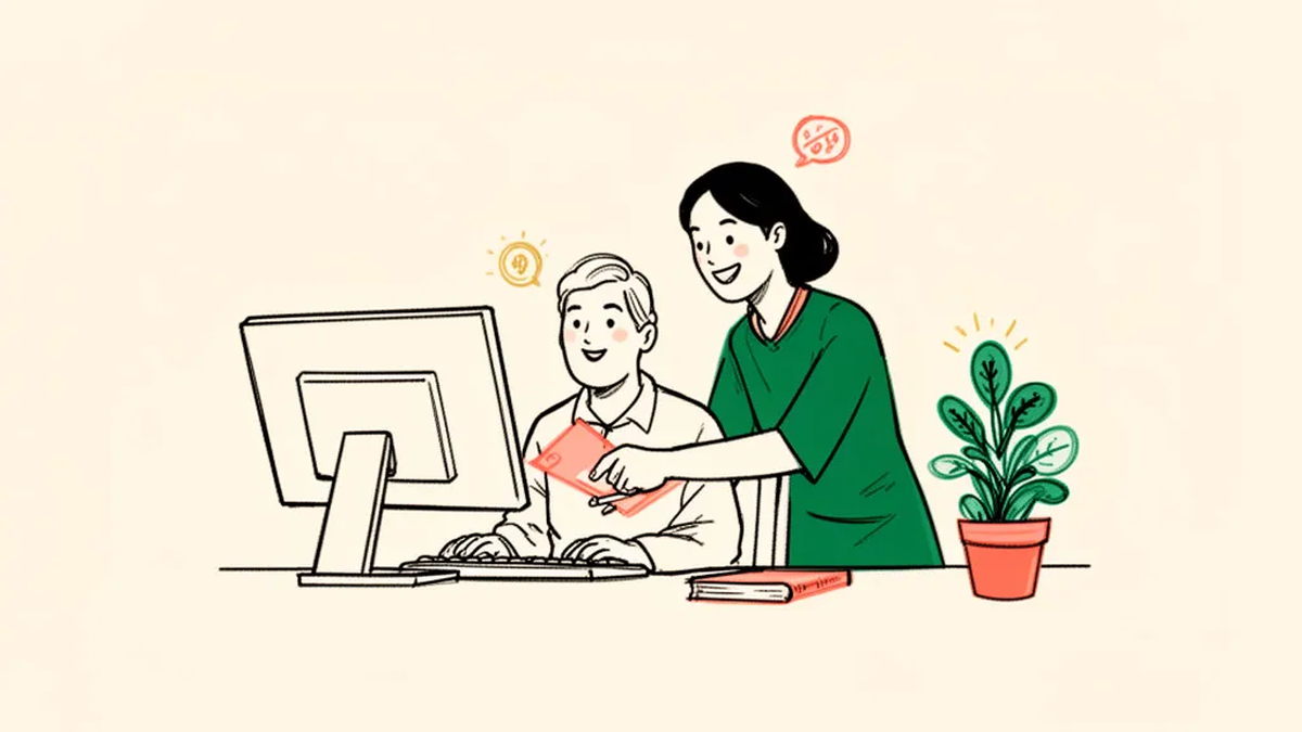 An instructor helping an adult learner at a computer during a job-training session