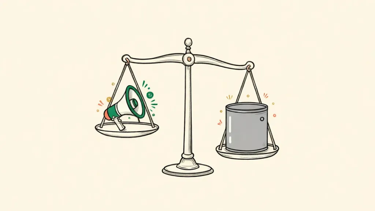 A balance scale with a small megaphone in one pan and a heavy industrial drum in the other